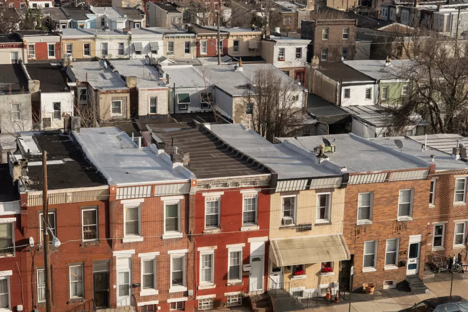 Aerial view of three-story brick rowhouses in Kensington neighborhood of Phialdelphia, Pennsylvania